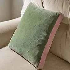 Pile of colorful scatter cushions ready for recycling service promoting sustainability