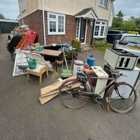 12 cubic yards / 9.12 cubic metres, approx two builder's skips. 900kg limit.